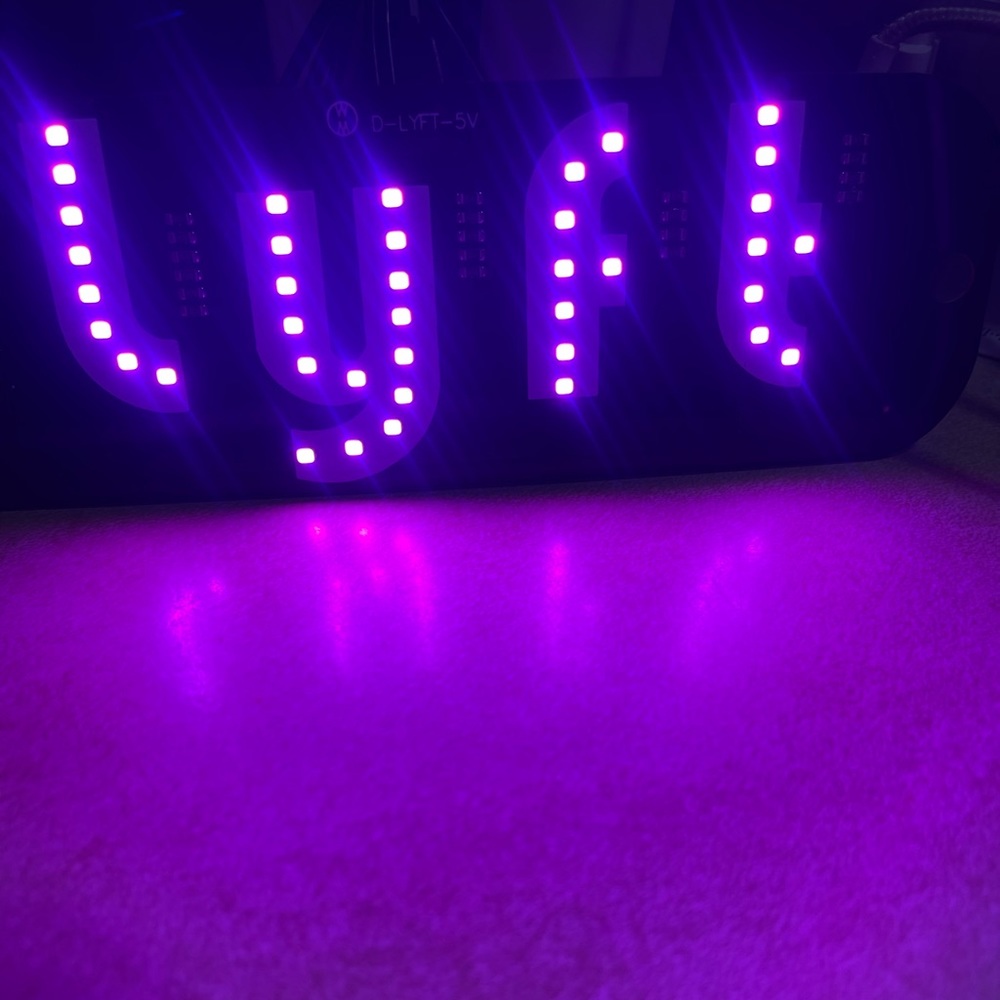 lyft sign light white and pink